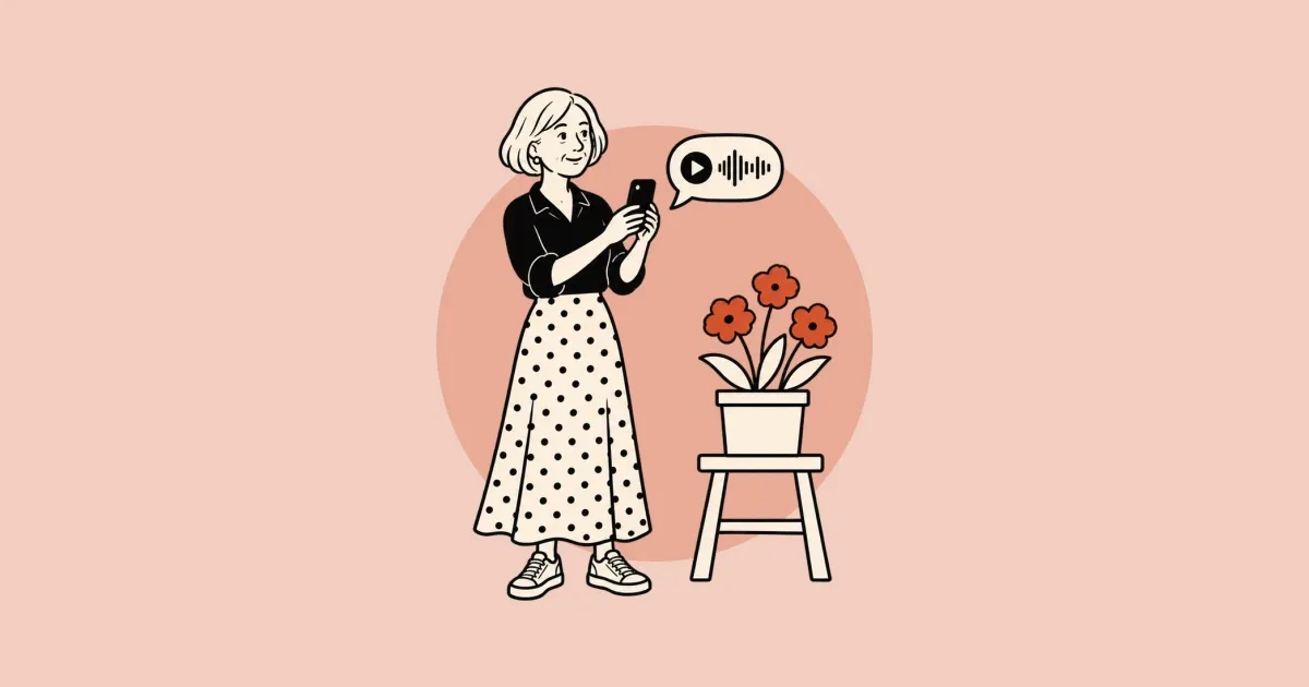 Una mujer mayor, de pie y sonriendo, fotografía con su celular una maceta con flores, mientras sobre ella flota un globo de nota de voz.
